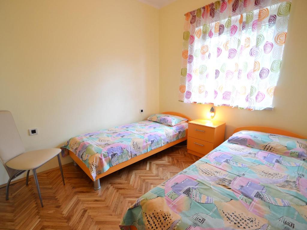 Postel nebo postele na pokoji v ubytování Holiday Home Jelka by Interhome