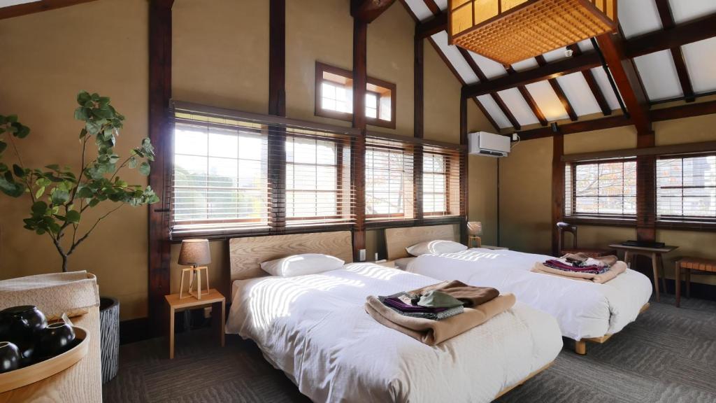 Postel nebo postele na pokoji v ubytování NIPPONIA HOTEL NARA NARAMACHI