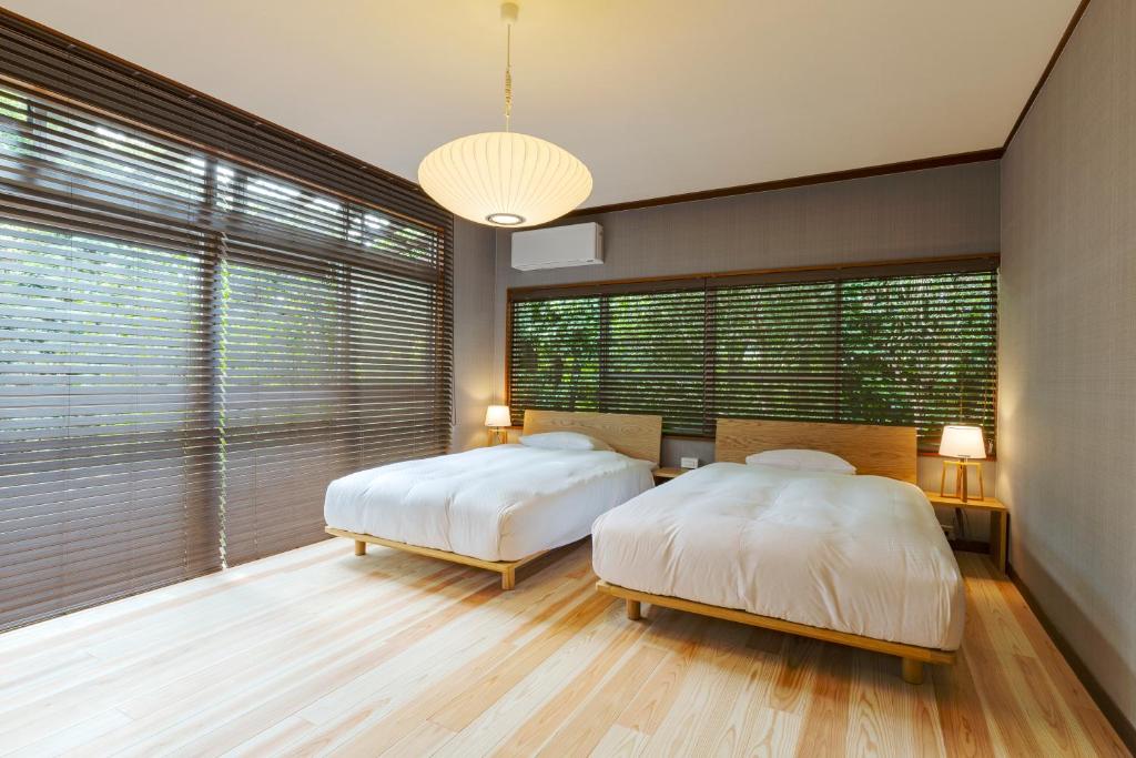 Postel nebo postele na pokoji v ubytování NIPPONIA HOTEL NARA NARAMACHI