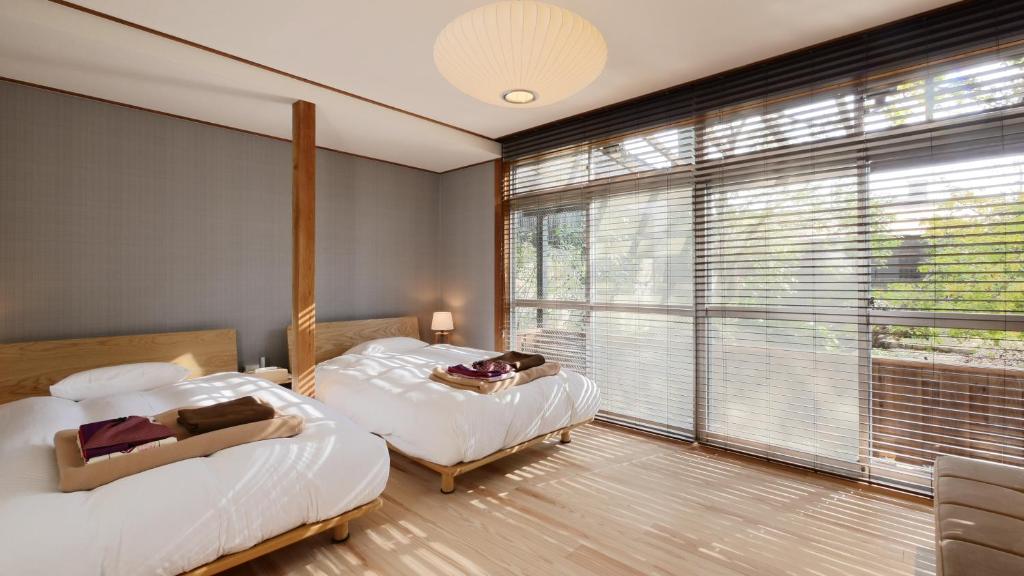 Postel nebo postele na pokoji v ubytování NIPPONIA HOTEL NARA NARAMACHI