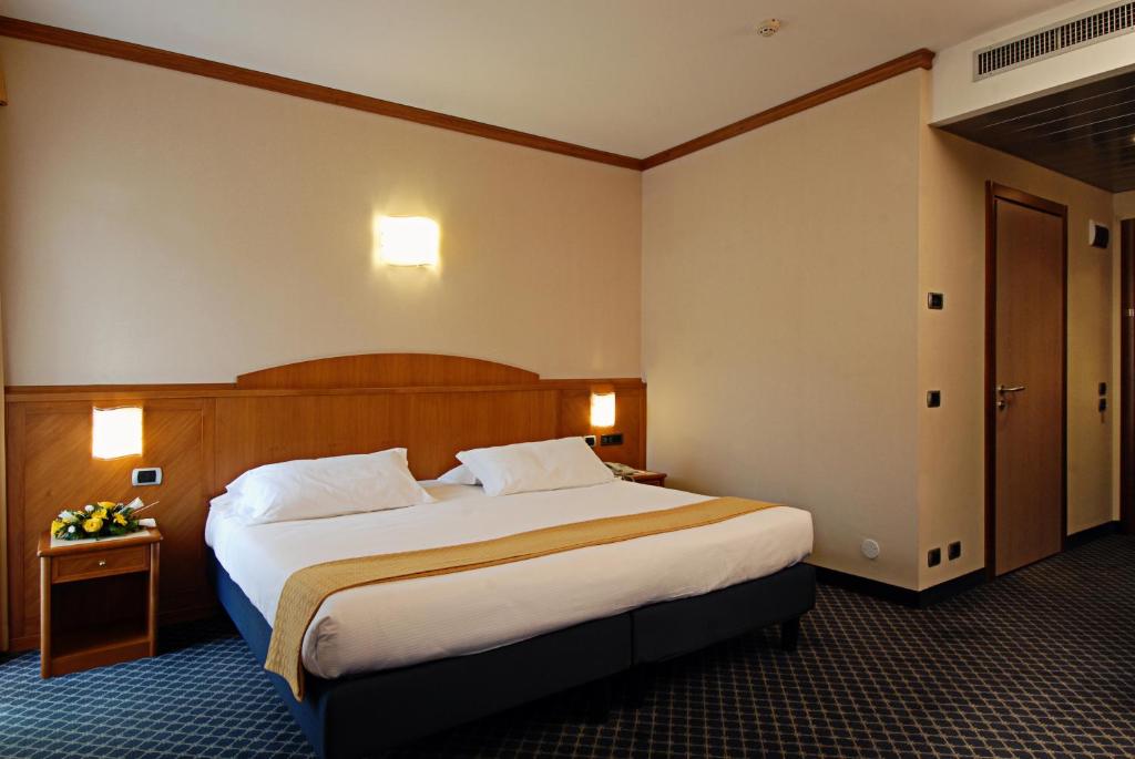 Postel nebo postele na pokoji v ubytování Hotel Sportsman