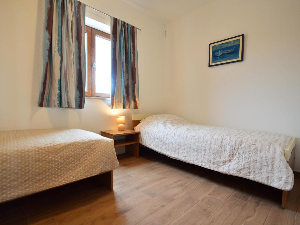 Postel nebo postele na pokoji v ubytování Apartment Kika-1 by Interhome