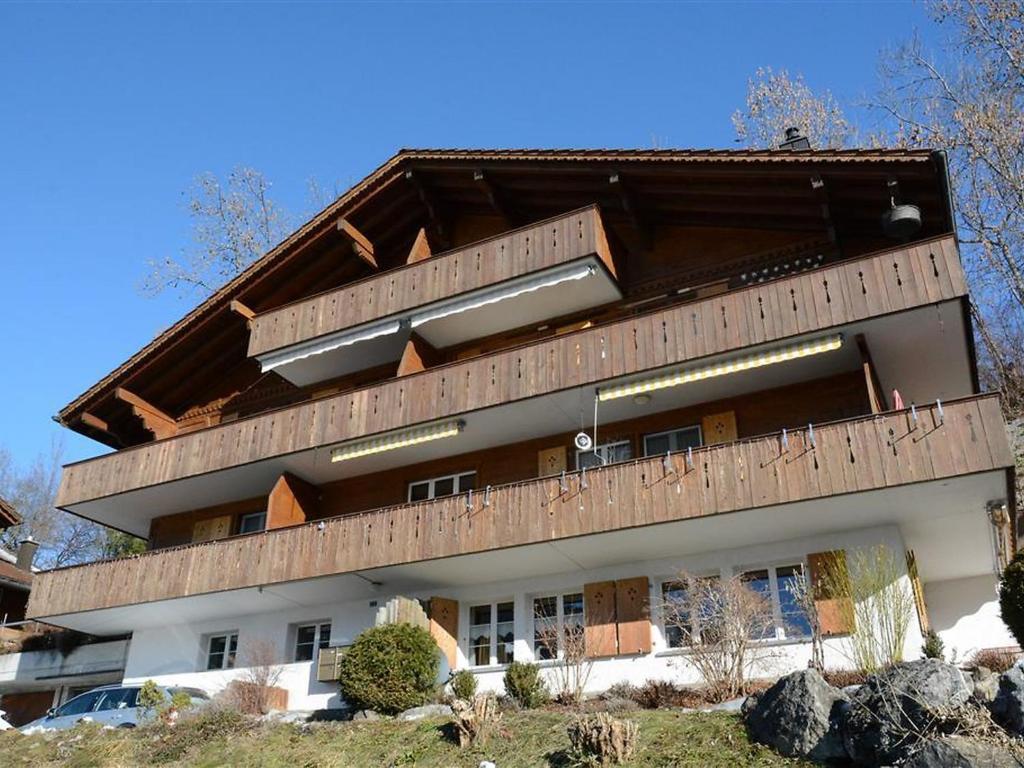 a building with a balcony on top of it at Apartment Fabiana by Interhome in Zweisimmen