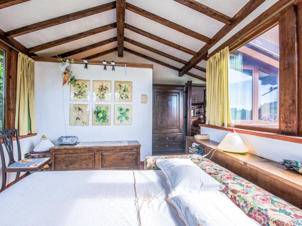 A bed or beds in a room at Holiday Home Villa Poggiobello by Interhome