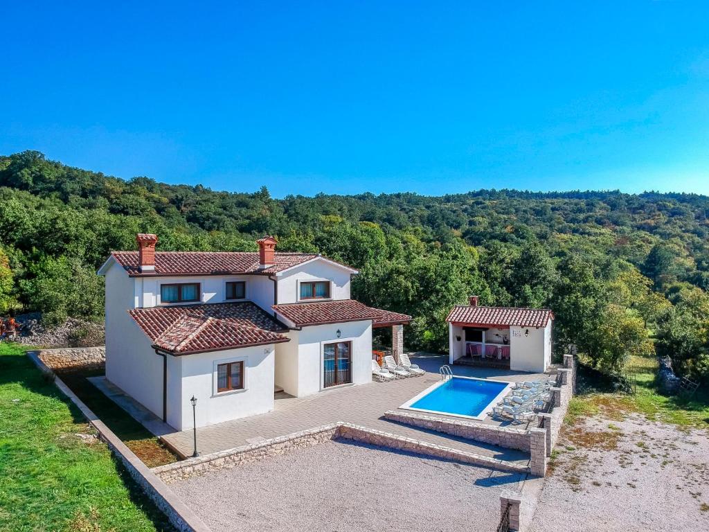 an aerial view of a house with a swimming pool at Holiday Home Dorijano by Interhome in Ripenda Kras