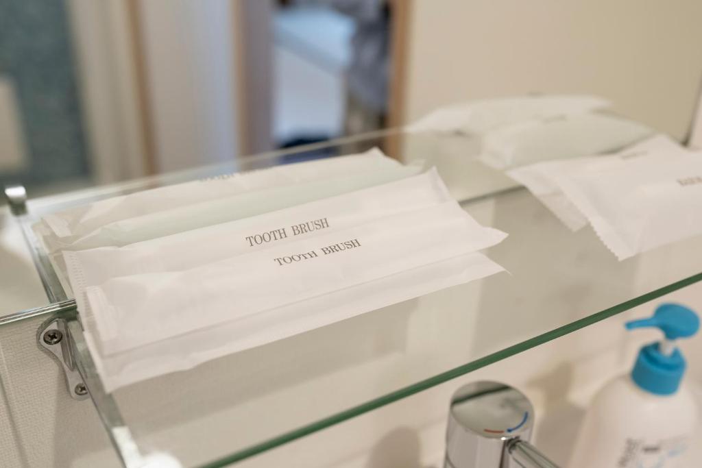 Postel nebo postele na pokoji v ubytování Kakigara Ryokan