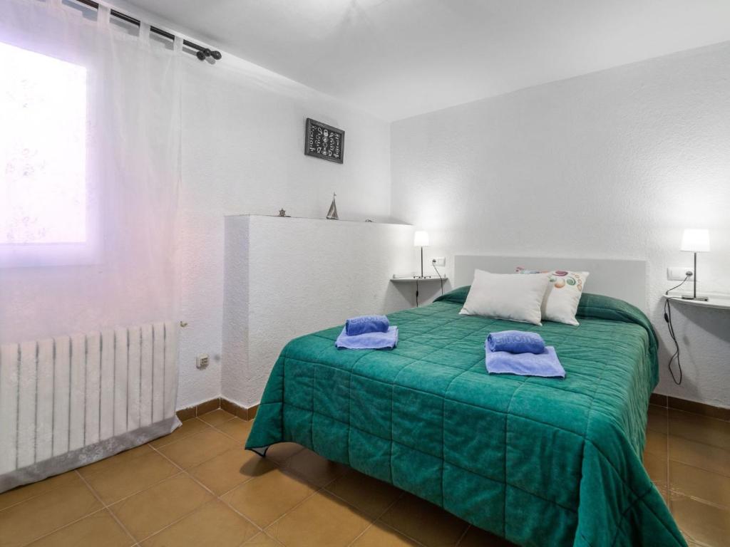 A bed or beds in a room at Holiday Home Platja by Interhome