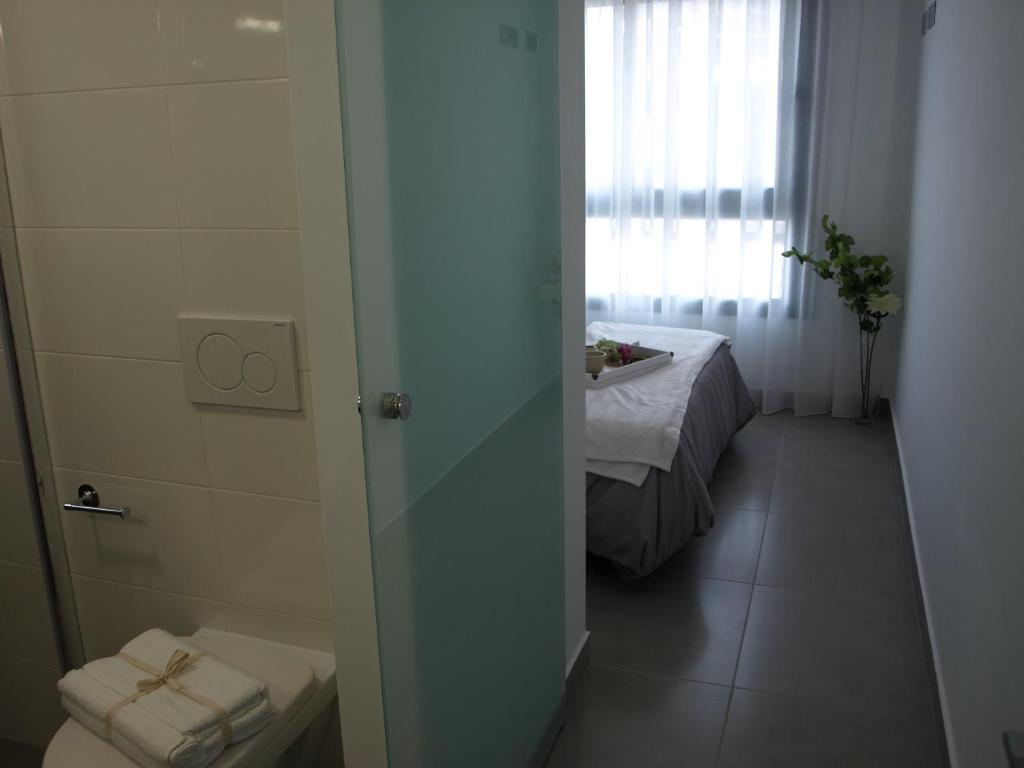 A bed or beds in a room at Penthouse Lamar 43.11