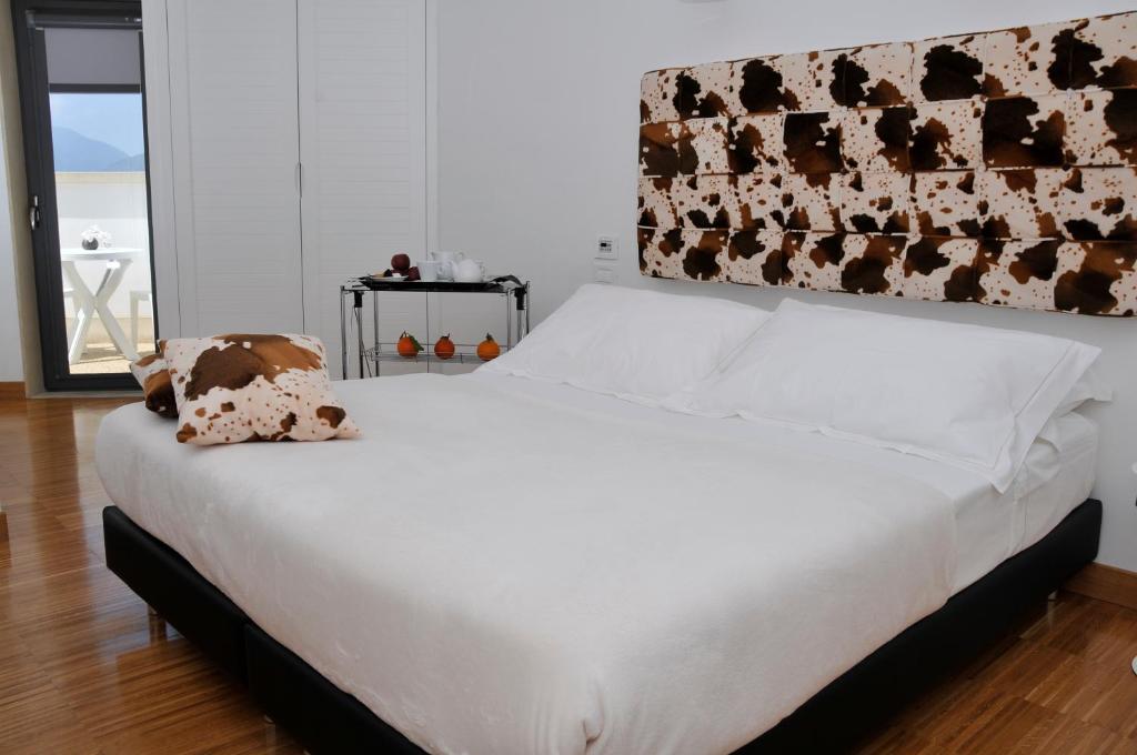 Postel nebo postele na pokoji v ubytování Hotel Del Conte