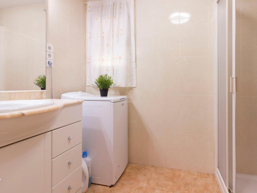 A bathroom at Apartment DMS IV-3 by Interhome