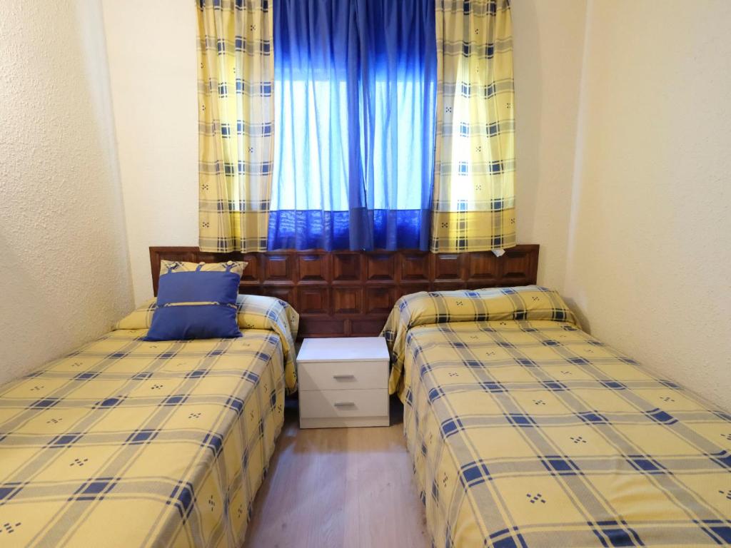 A bed or beds in a room at Apartment DMS IV-3 by Interhome