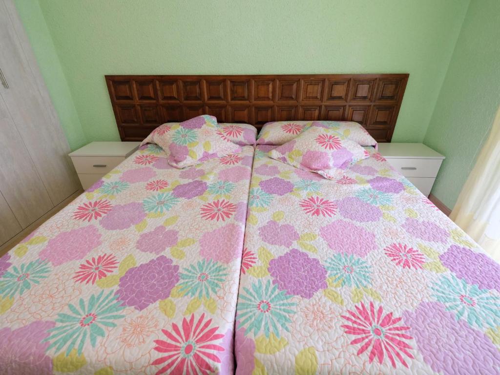 A bed or beds in a room at Apartment DMS IV-3 by Interhome