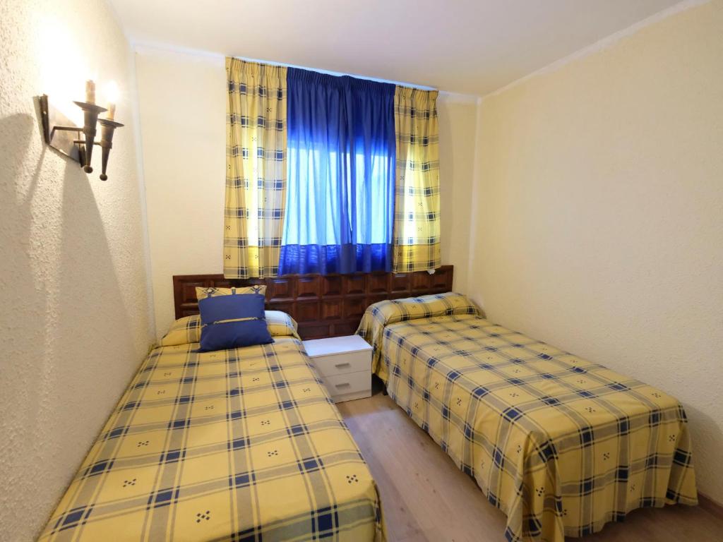 A bed or beds in a room at Apartment DMS IV-3 by Interhome