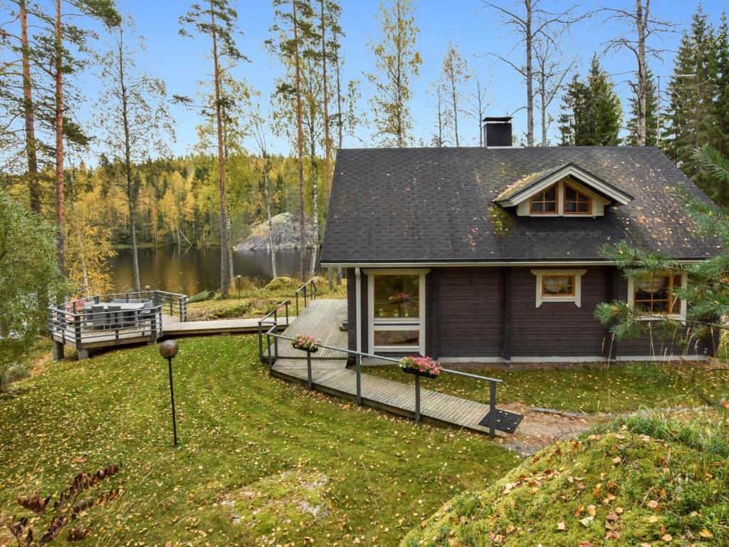 a small house with a dock in the yard at Holiday Home Mykkylä by Interhome in Niemi