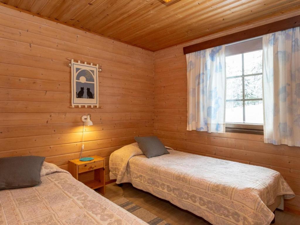 Postel nebo postele na pokoji v ubytování Holiday Home Aamunsarastus by Interhome