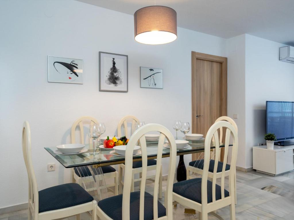 A television and/or entertainment centre at Apartment Carihuela Playa-2 by Interhome