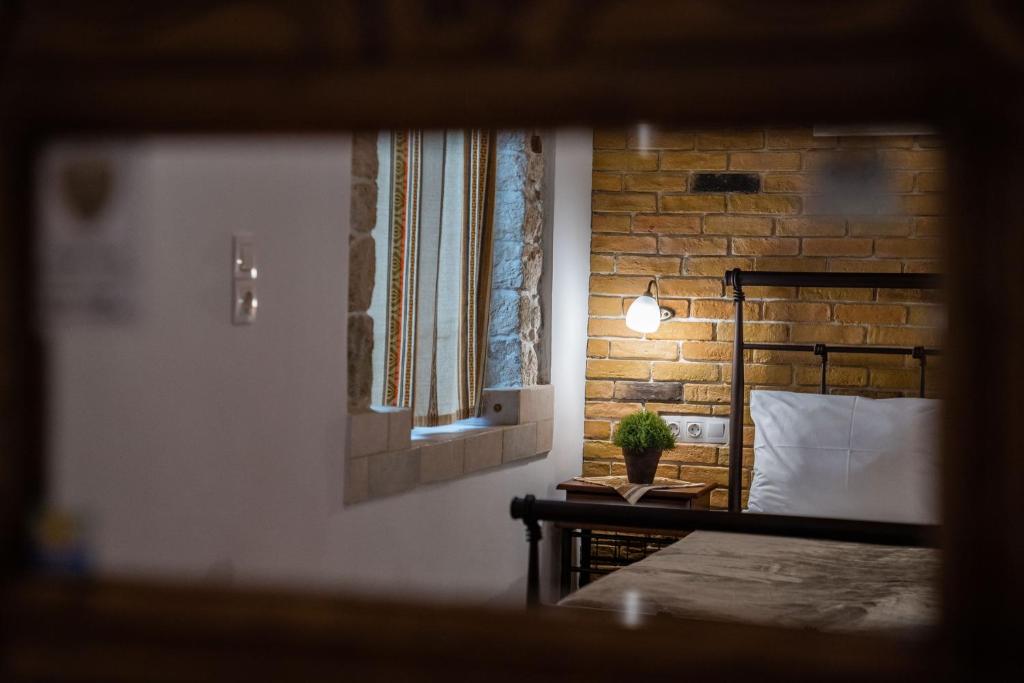 Postel nebo postele na pokoji v ubytování Cretan Villa Hotel