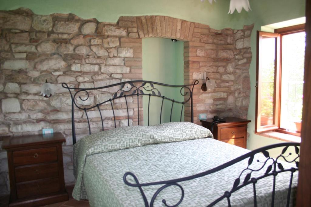 Łóżko lub łóżka w pokoju w obiekcie Agriturismo Il Casale