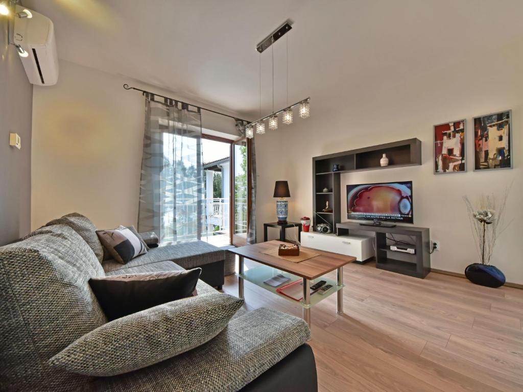 TV a/nebo společenská místnost v ubytování Holiday Home M by Interhome
