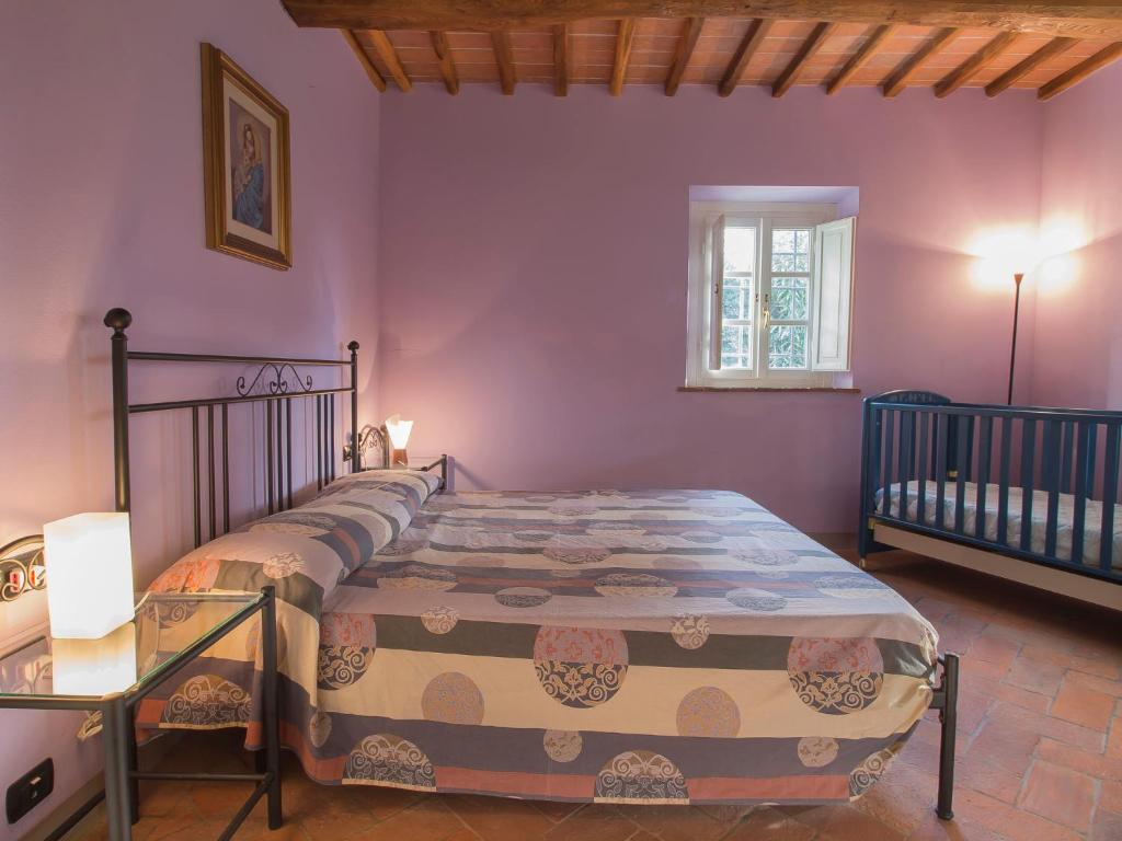 A bed or beds in a room at Holiday Home Villa il Pellicano by Interhome
