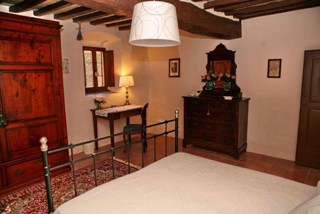 Postel nebo postele na pokoji v ubytování Residenza Antico Chianti