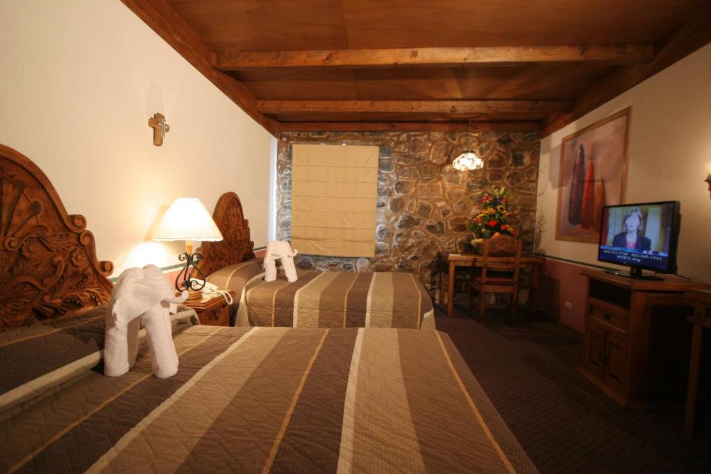 TV a/nebo společenská místnost v ubytování Posada de la Aldea