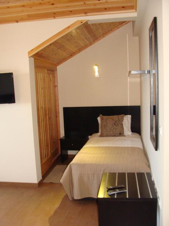 Postel nebo postele na pokoji v ubytování Apartamentos Kósmos
