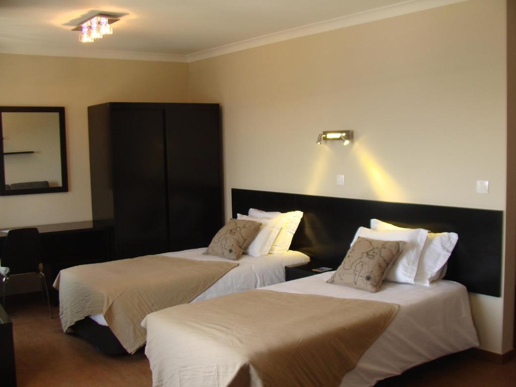 Postel nebo postele na pokoji v ubytování Apartamentos Kósmos
