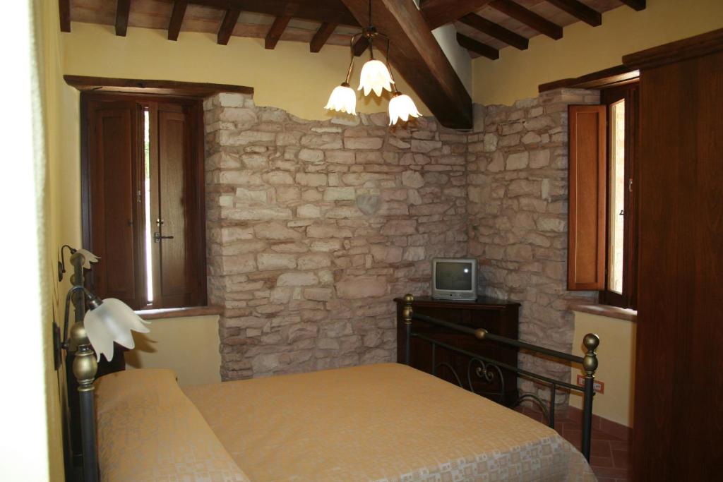 Łóżko lub łóżka w pokoju w obiekcie Agriturismo Il Casale