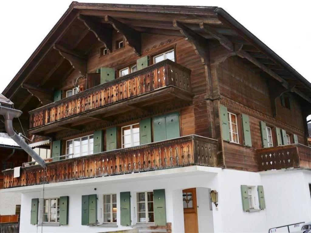 a building with a balcony on top of it at Apartment Studio Oehrli by Interhome in Gstaad