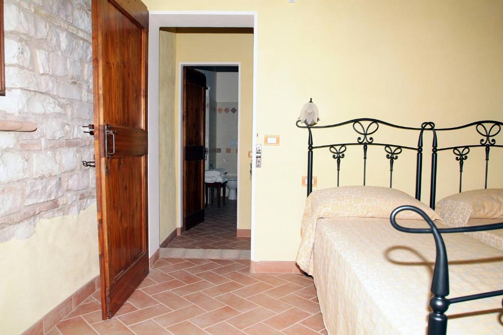 Łóżko lub łóżka w pokoju w obiekcie Agriturismo Il Casale