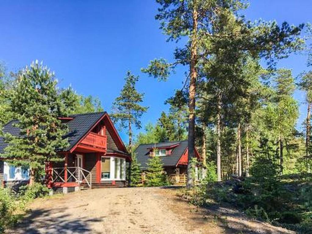 a house on a dirt road in the woods at Holiday Home Hästöskata b by Interhome in Kruunupyy