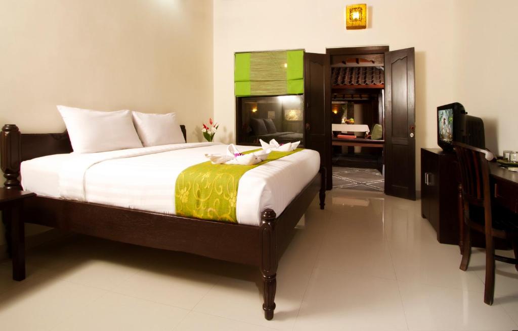 Postel nebo postele na pokoji v ubytování Bali Ayu Hotel & Villas