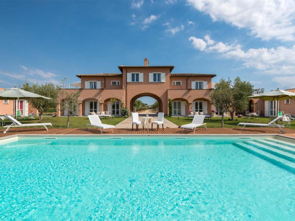 a villa with a swimming pool and a house at Villa Marina Velca by Interhome in Tarquinia