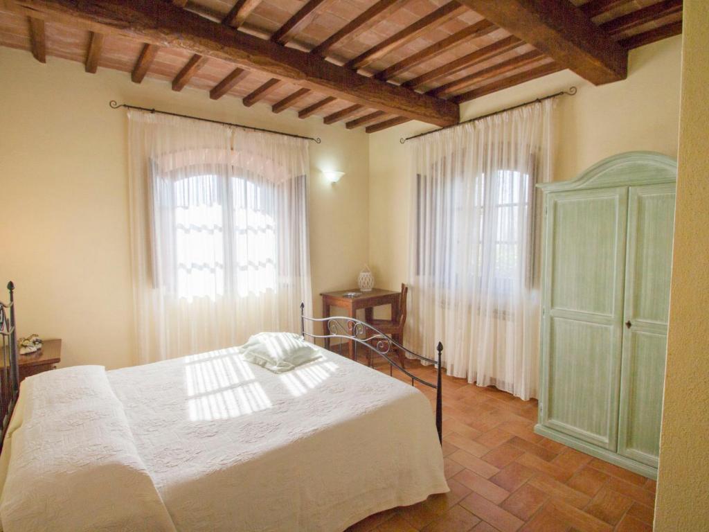 A bed or beds in a room at Holiday Home Montecucco Winery by Interhome
