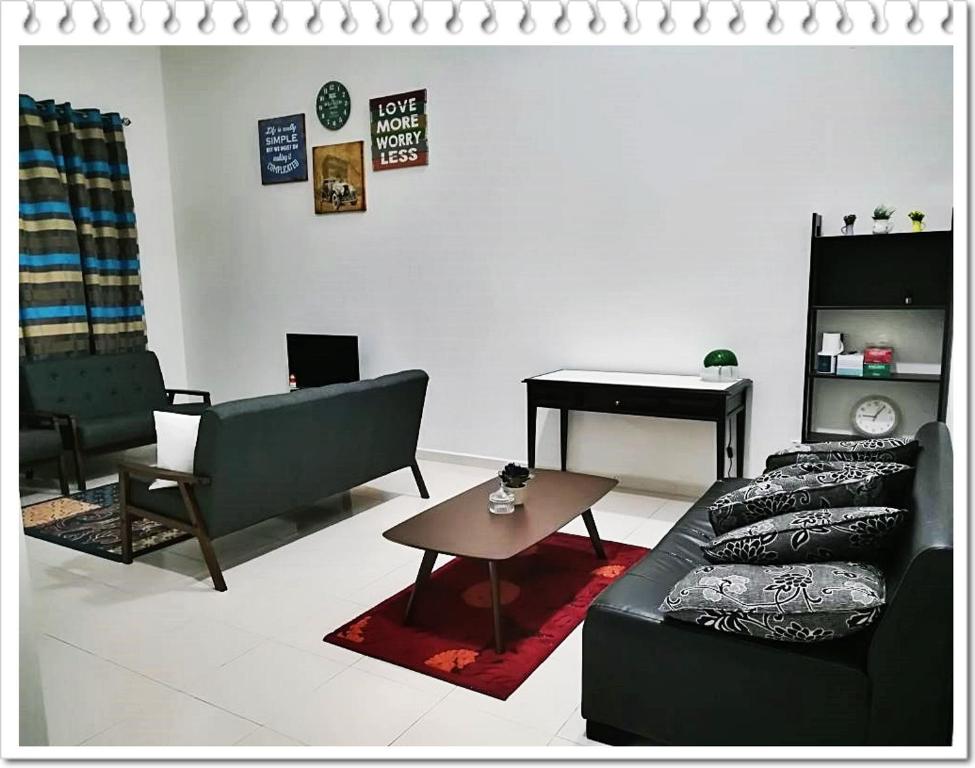 a living room with a couch and a table and a piano at Fazz Homestay Melaka in Melaka