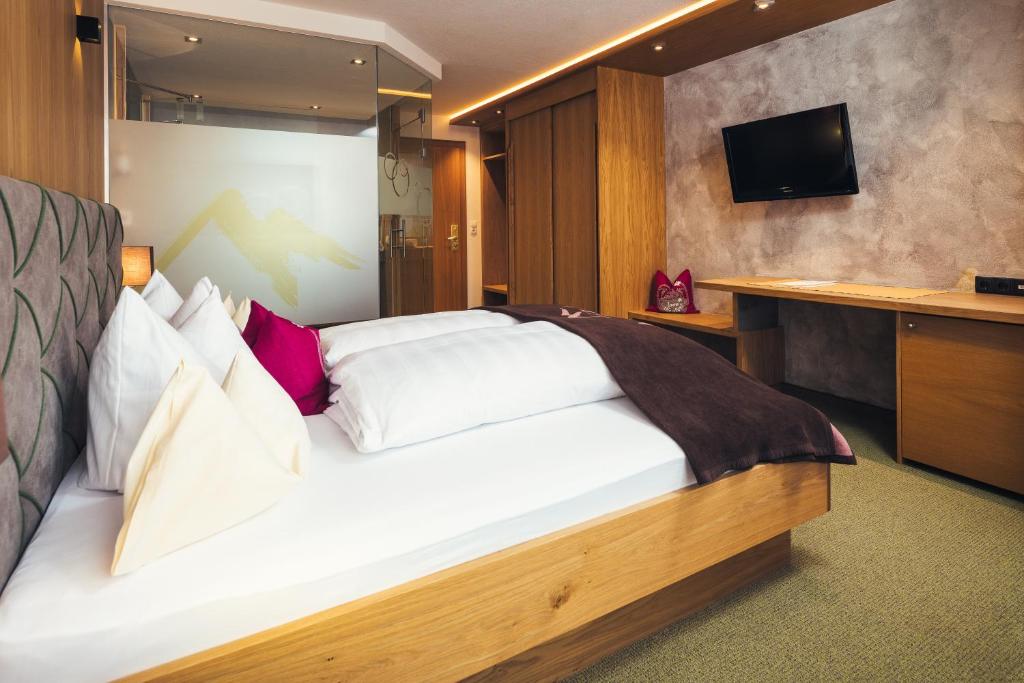 Postel nebo postele na pokoji v ubytování Hotel Garni Angela