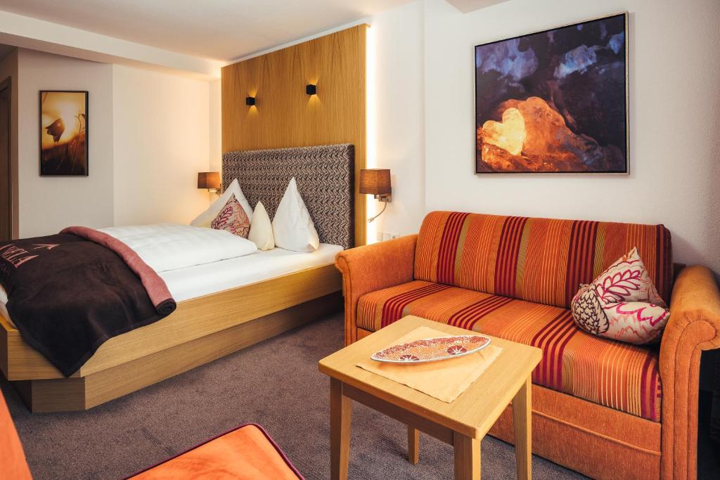 Postel nebo postele na pokoji v ubytování Hotel Garni Angela