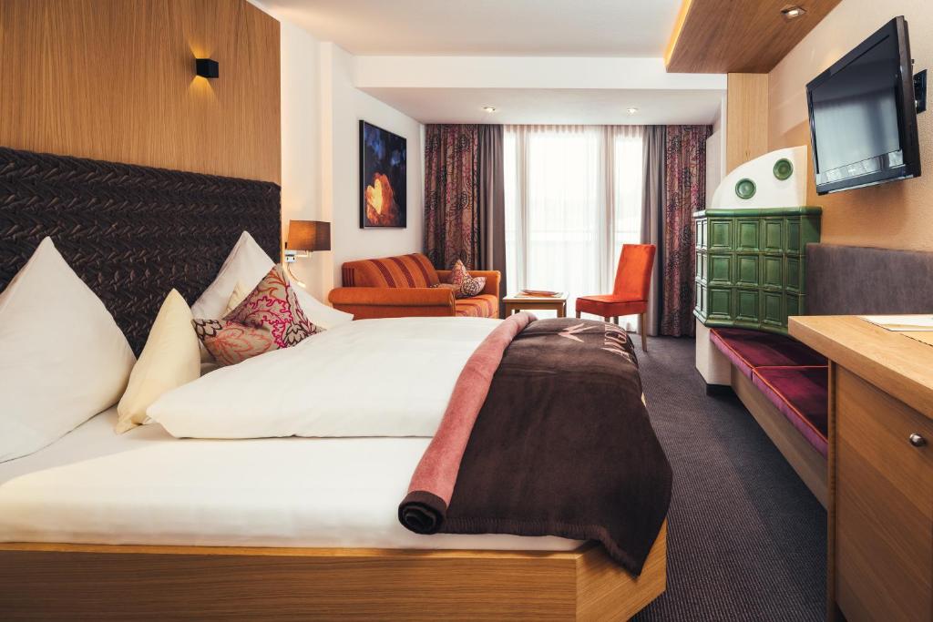 Postel nebo postele na pokoji v ubytování Hotel Garni Angela