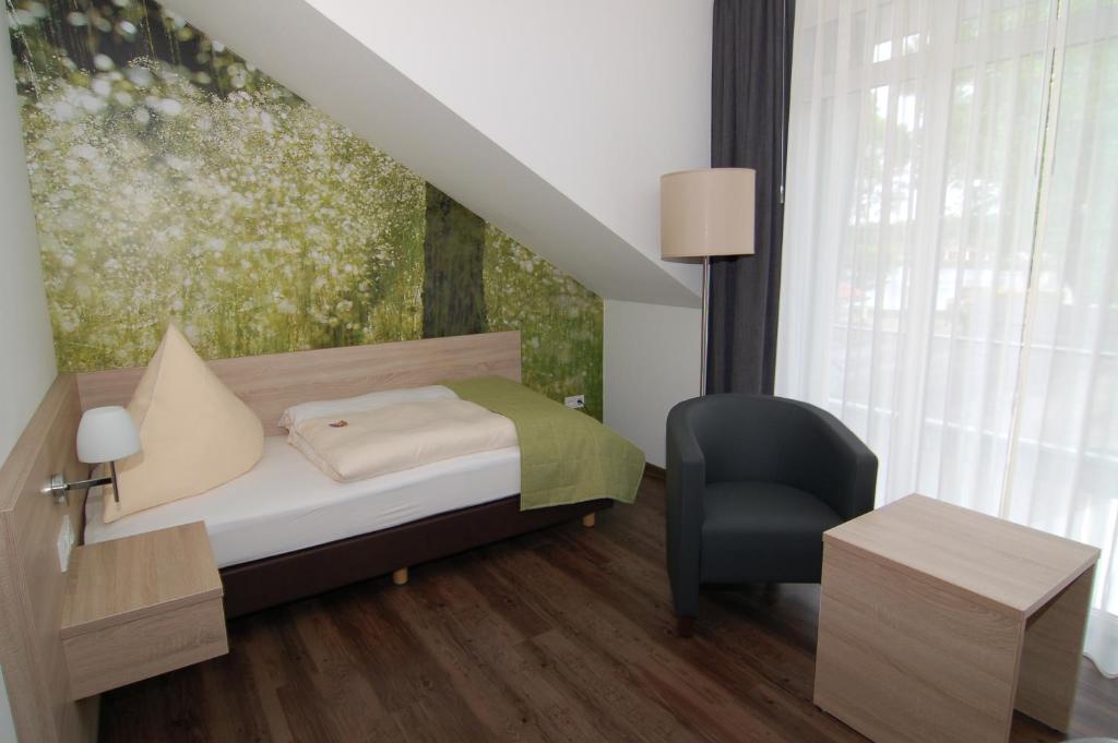 Postel nebo postele na pokoji v ubytování Ringhotel Alfsee Piazza