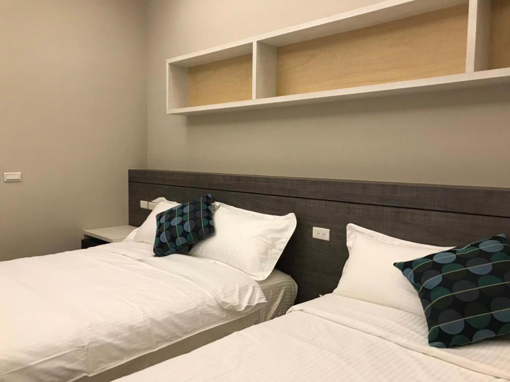Postel nebo postele na pokoji v ubytování Good Nest Homestay
