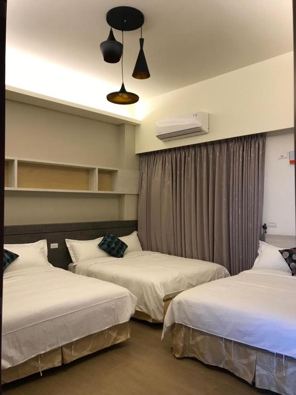 Postel nebo postele na pokoji v ubytování Good Nest Homestay