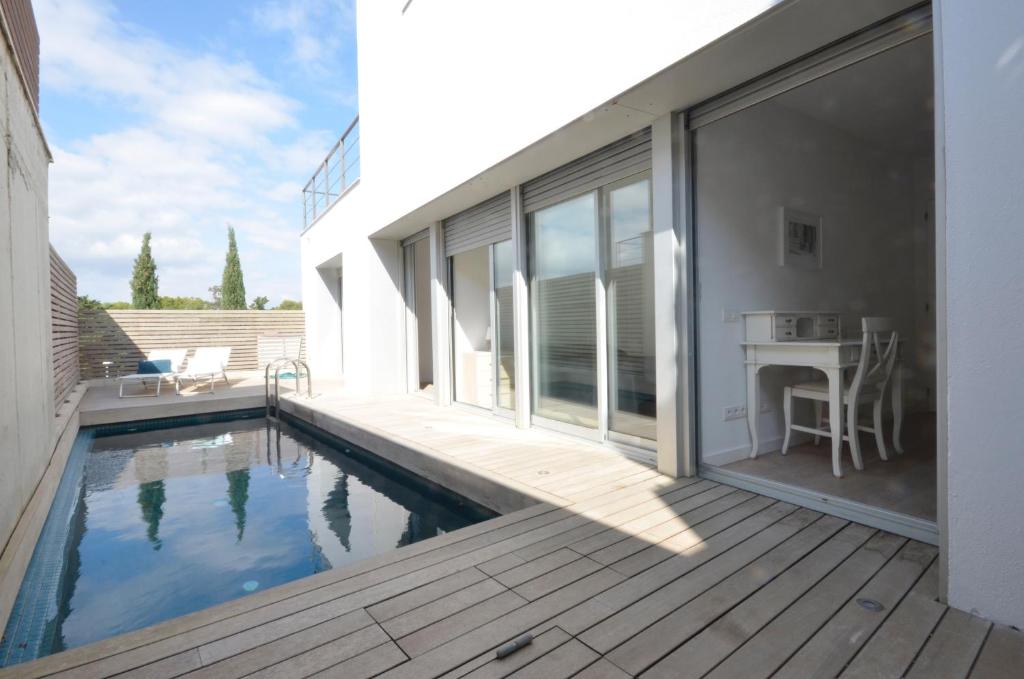 a house with a swimming pool and a patio at Bellavista - Ref. 029 in Begur