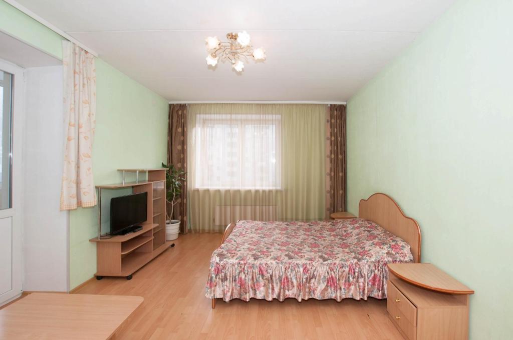 Tempat tidur dalam kamar di Марьин Дом на Июльской, 25