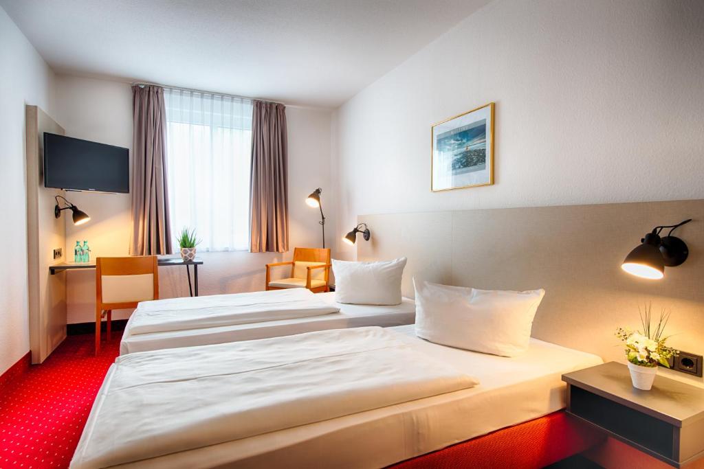 Postel nebo postele na pokoji v ubytování ACHAT Hotel Chemnitz