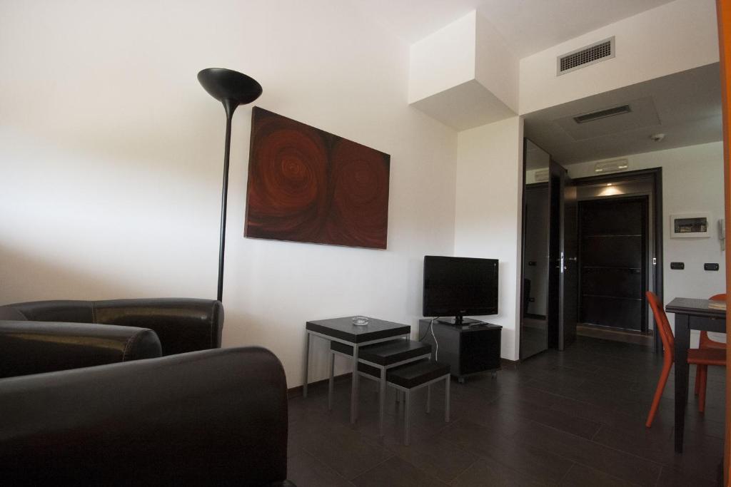 Telewizja i/lub zestaw kina domowego w obiekcie Della Piana Residence