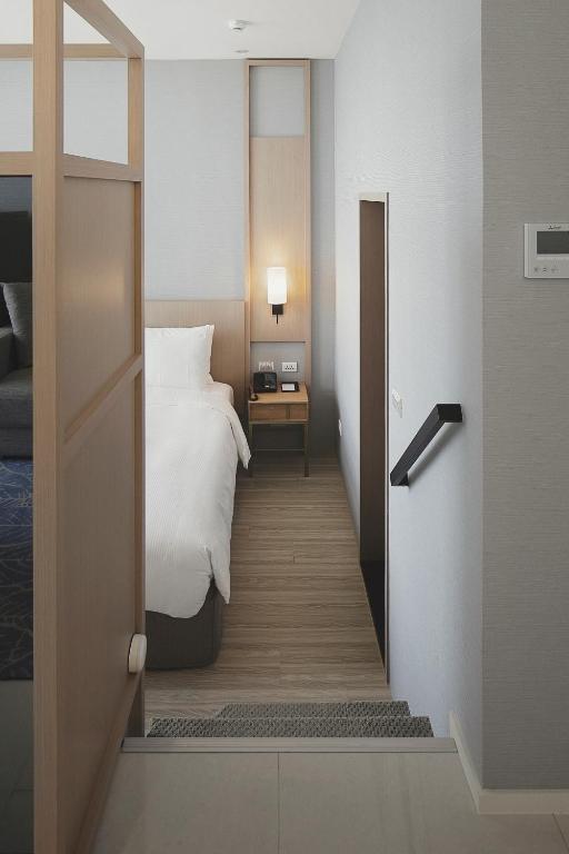 Postel nebo postele na pokoji v ubytování Jolley Hotel