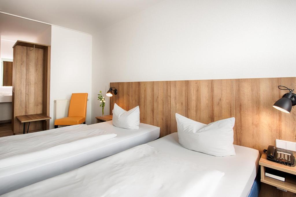 Postel nebo postele na pokoji v ubytování ACHAT Hotel Dresden Altstadt