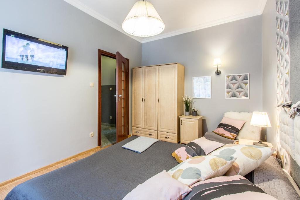Posteľ alebo postele v izbe v ubytovaní Apartament Bulwary Zakopane