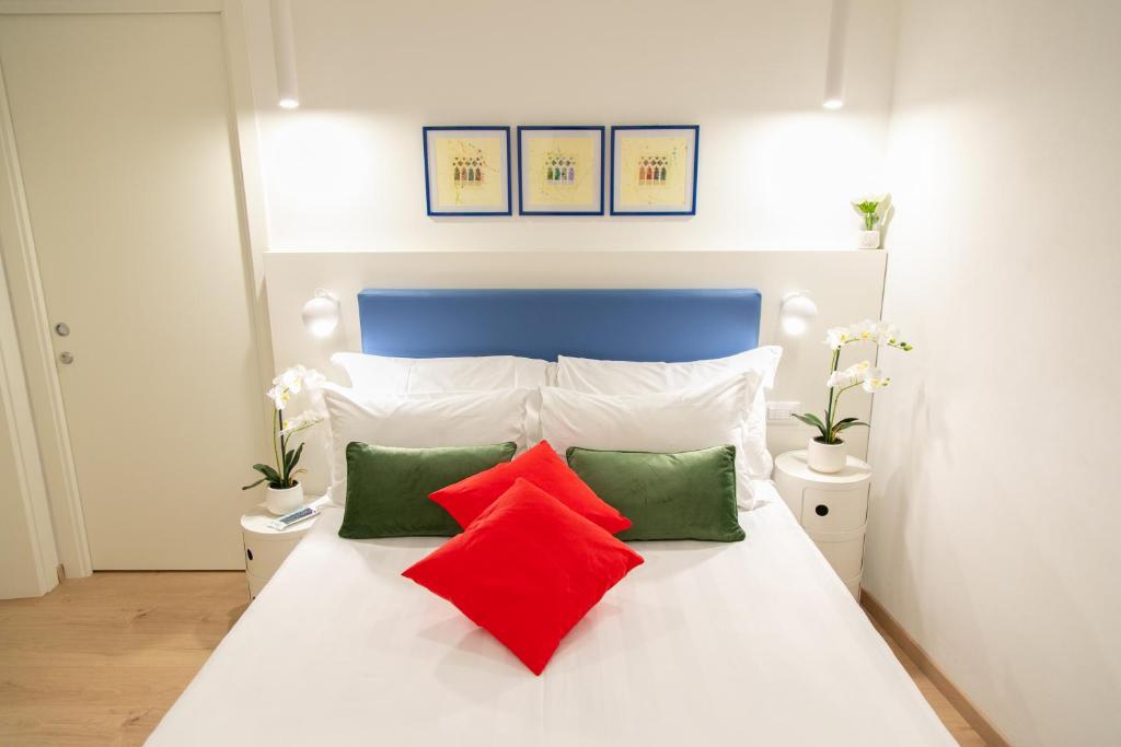 A bed or beds in a room at San Marco Design Suites